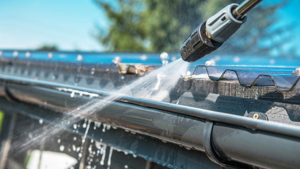 Pressure washing a gutter